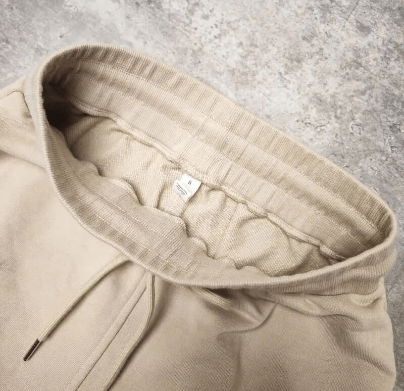 Close-up of Outfit Fitness Cotton Loose Sweatshirt, showcasing premium beige fabric and detailing for comfort and style.